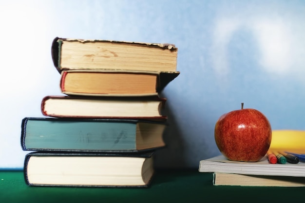 Education concept books stack apple and pen