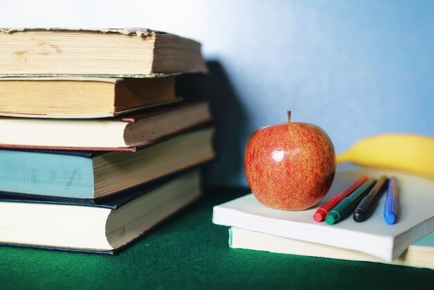 Education concept books stack apple and pen