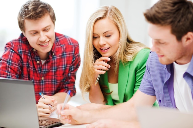 education concept - group of students studying at school