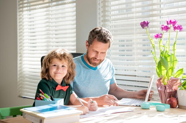 Education concept homeschooling and help back to school parenthood cheerful father and son