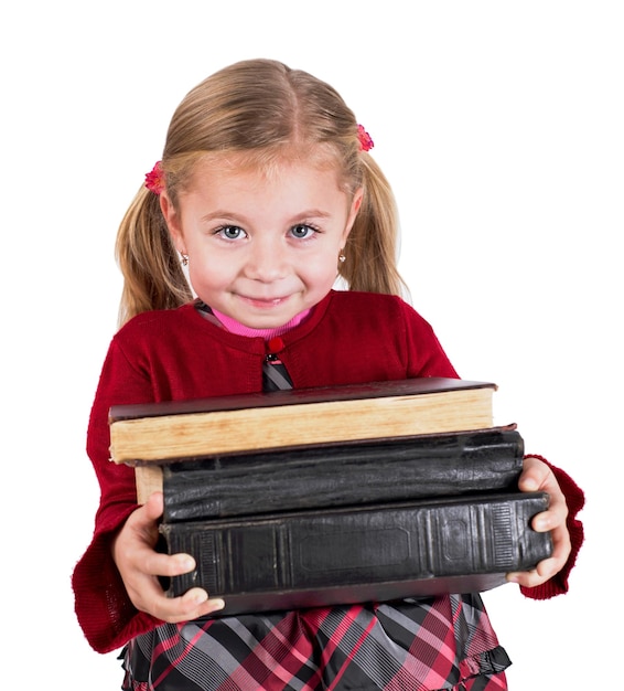 Концепция образования Любознательный ребенок Маленькая девочка с книгами готовится вернуться в школу