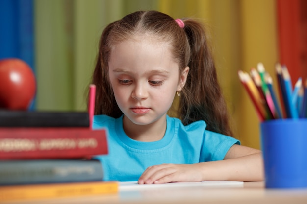 Education concept - little schoolgirl