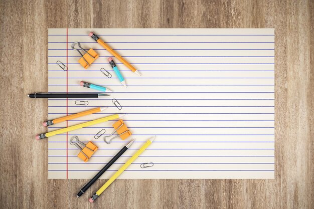education concept with stationery on spaced page on wooden table and place for your logo or text 3d rendering