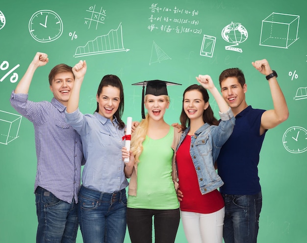 education, friendship, graduation, gesture and people concept - group of smiling students standing over green board