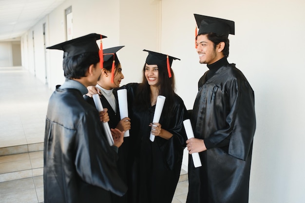 Education graduation and people concept  group of happy international students