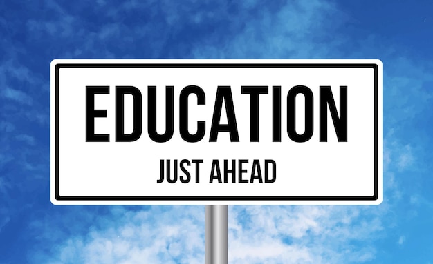 Education just ahead road sign on sky background