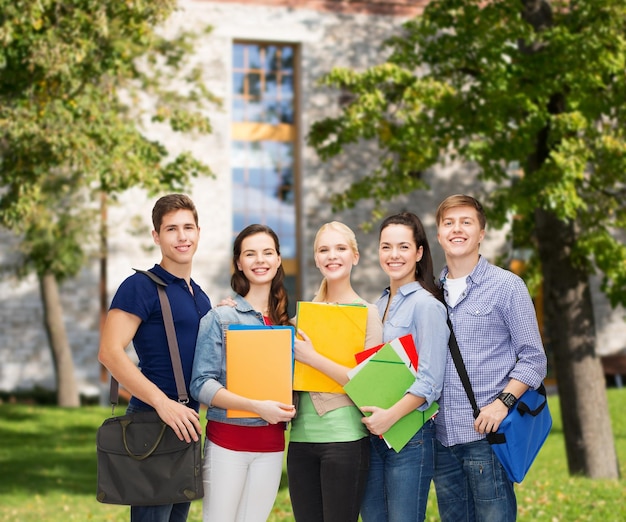 education and people concept - group of smiling students standing