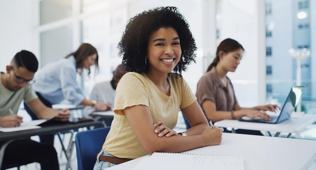 Education portrait and girl university student in classroom for business management lecture or studying Phd face and happy female college learner in a lecture for future career or development