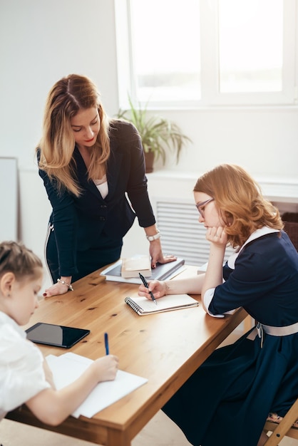 Education school lesson female teacher with pupils