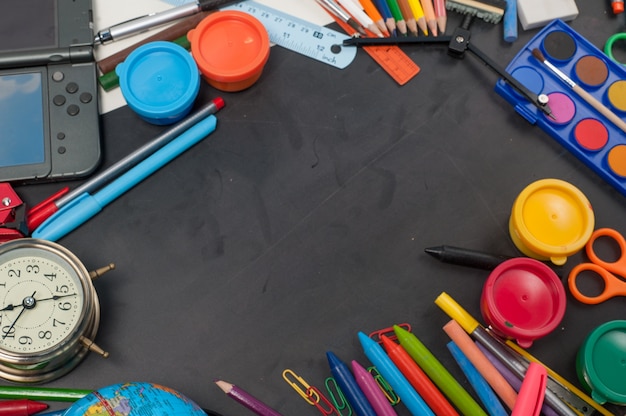 Photo education school tools on black chalkboard  background