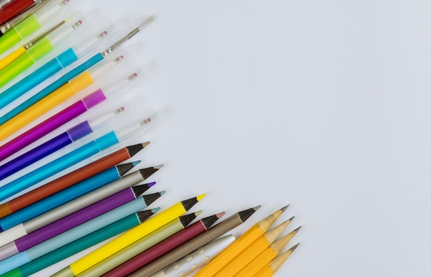 Education time a different colored stationery in stands on a variety school supplies