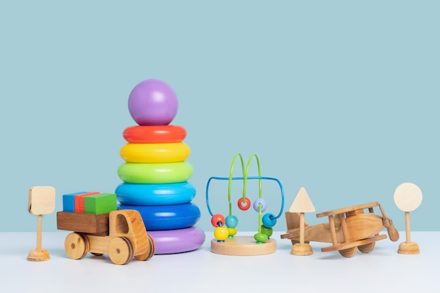 educational toys for preschool children wooden and plastic toys on a blue background copy space