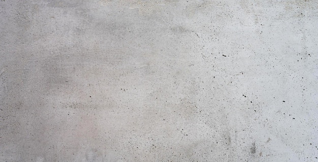 Een betonnen vloer met een witte achtergrond en een zwart-witte kleur.