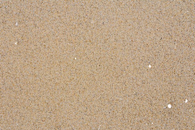 Een betoverende achtergrond van zand met een boeiend motief