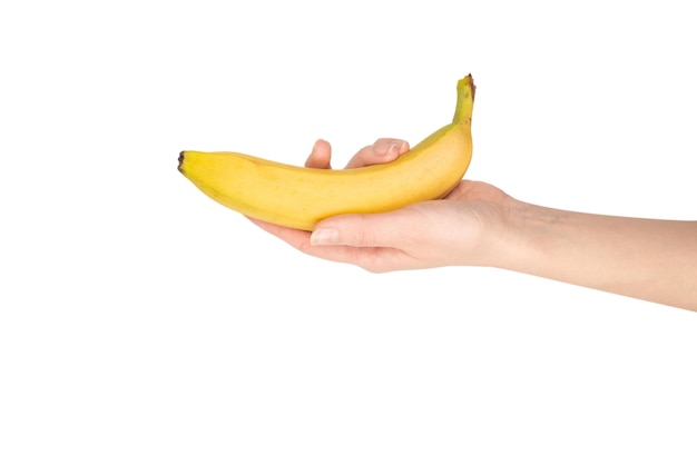 Een bos van bananen in vrouwenhand die op witte achtergrond wordt geïsoleerd