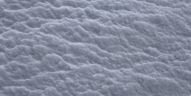 Een close-up van de sneeuwtextuur met de textuur van de sneeuw.