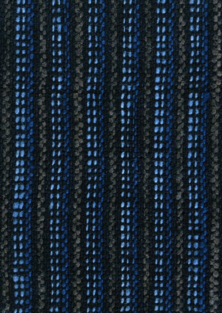 Foto een close-up van een mesh hek met blauwe en zwarte strepen