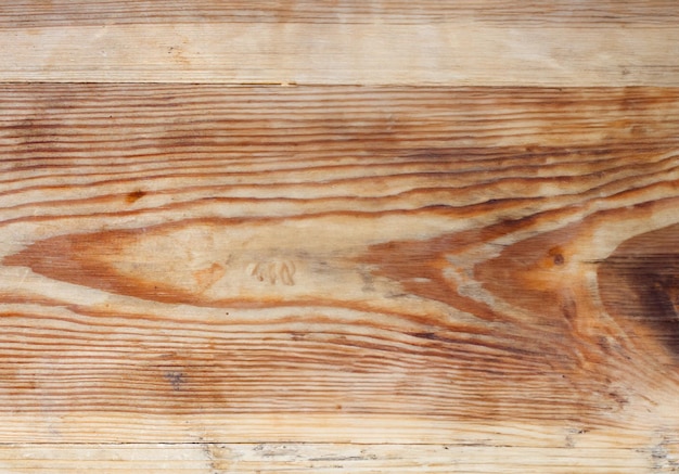 Een close-up van een rijke bruine houten achtergrond met een warme, rustieke uitstraling