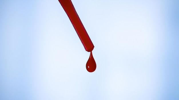 Een druppel bloed Pipet Druipende rode vloeistof Een druppel rood Test de bloedgroep