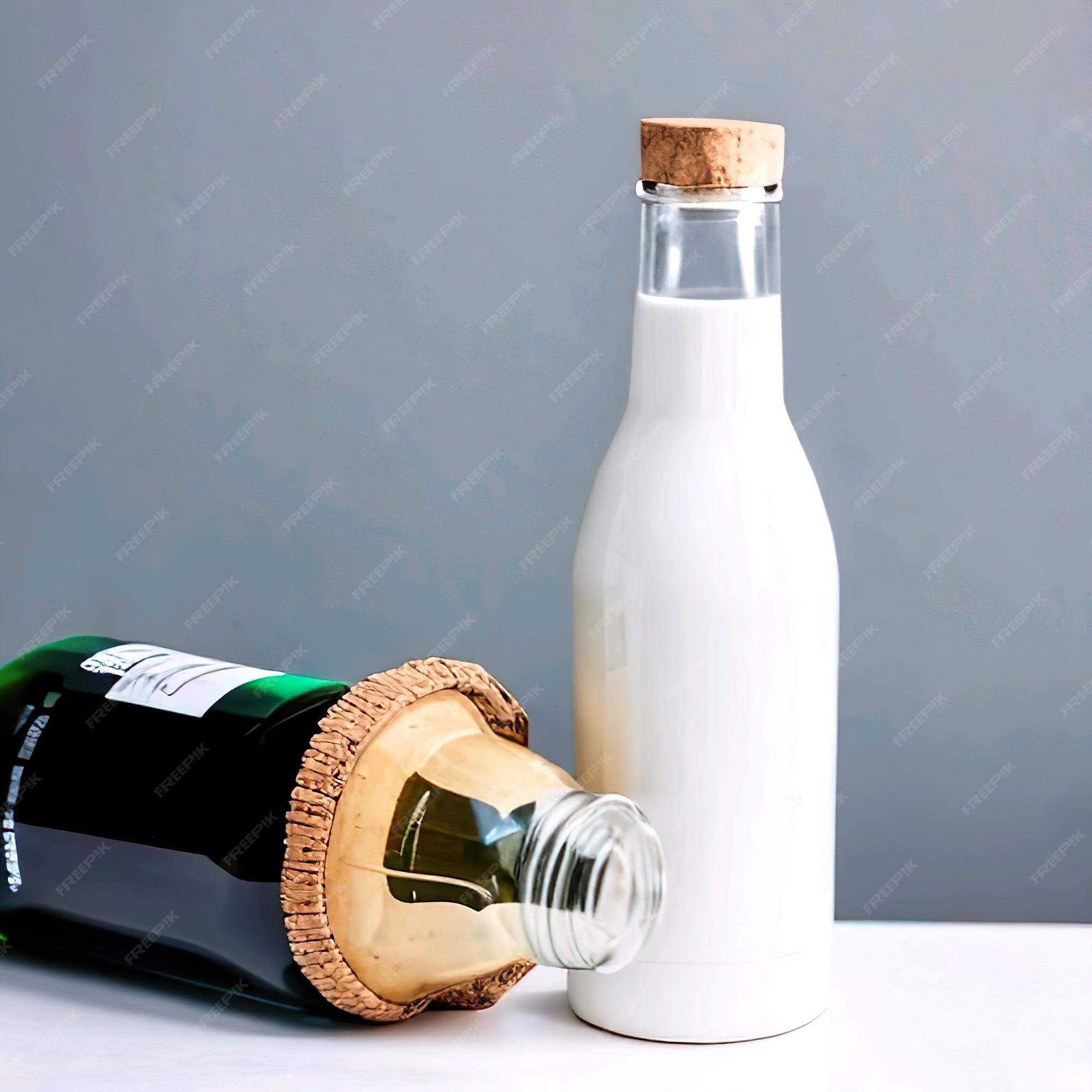 op gang brengen Brood identificatie Een fles wijn met een kurk erin en een fles witte wijn. | Premium Foto