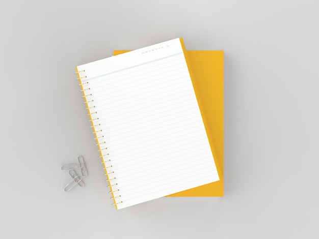 een geel notitieboek met een pen erop en een pen in de hoek