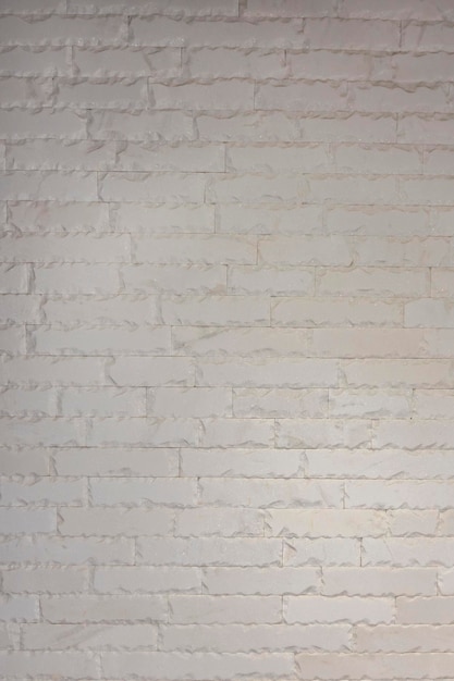 Een muur van witte decoratieve bakstenen Huisontwerp gipsbaksteen
