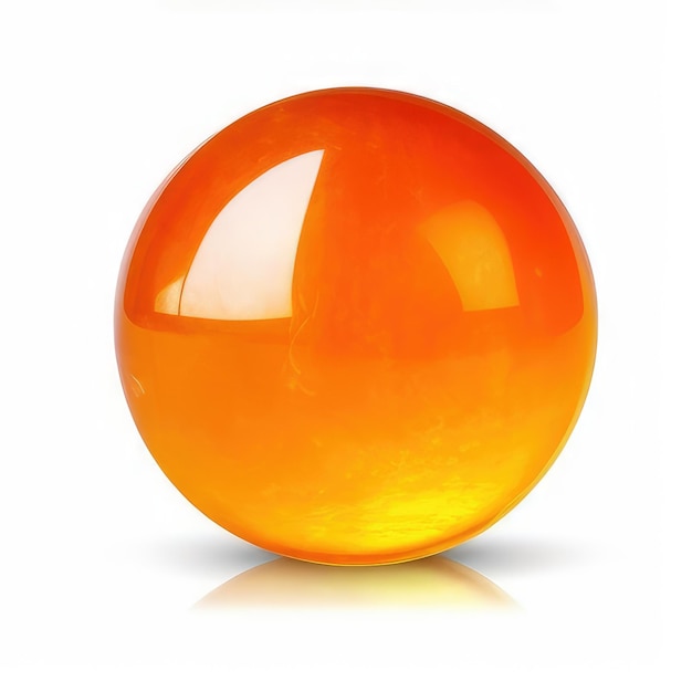 Een oranje glazen object met een reflectie van de zon erop.