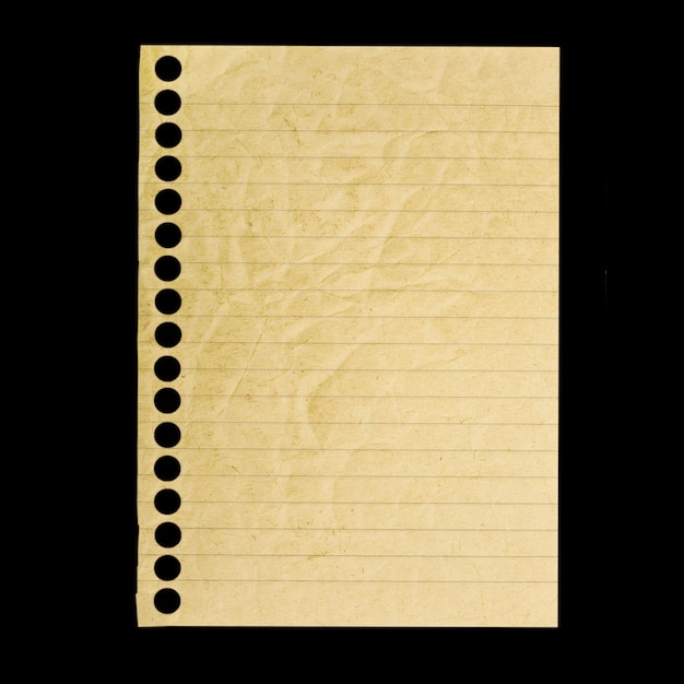 Foto een papieren notitieboekje geïsoleerd op de zwarte achtergrond