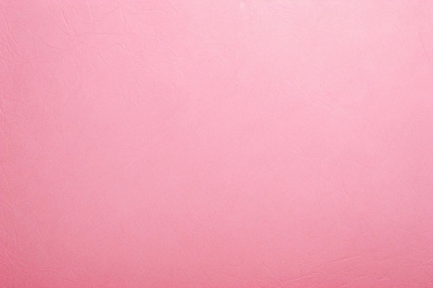 Een roze achtergrond met een ruwe textuur van een roze oppervlak.