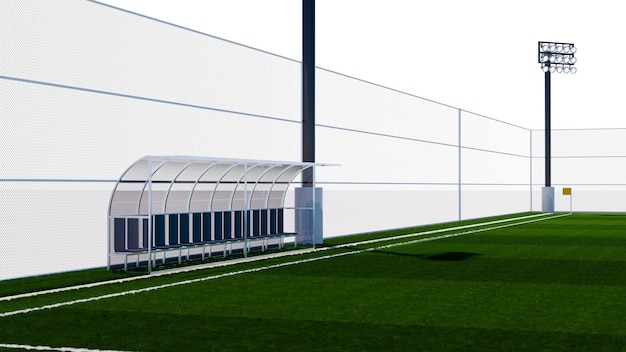 Een voetbalveld met een groen veld en een wit hek.