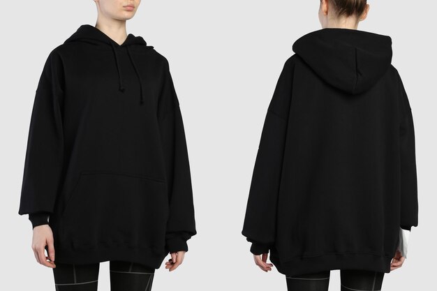 Een vrouw draagt een zwarte hoodie