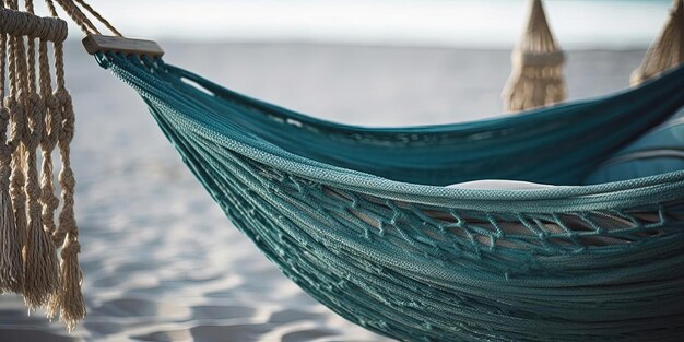 een witte hangmat met blauw touw op een strand in de stijl van donkere smaragd en beige