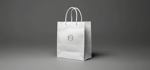 Een witte tas met een knoop erop waarop het bedrijf staat