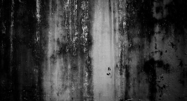 Een zwart-wit foto van een grunge muur met een grunge effect.
