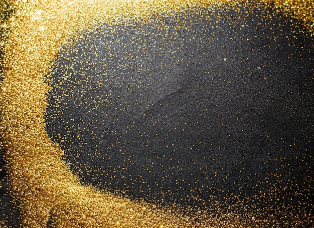 Een zwarte achtergrond met gouden glitter en zwarte glitter