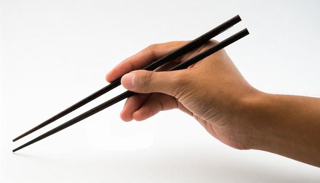 Eetstokjes in de hand geïsoleerd