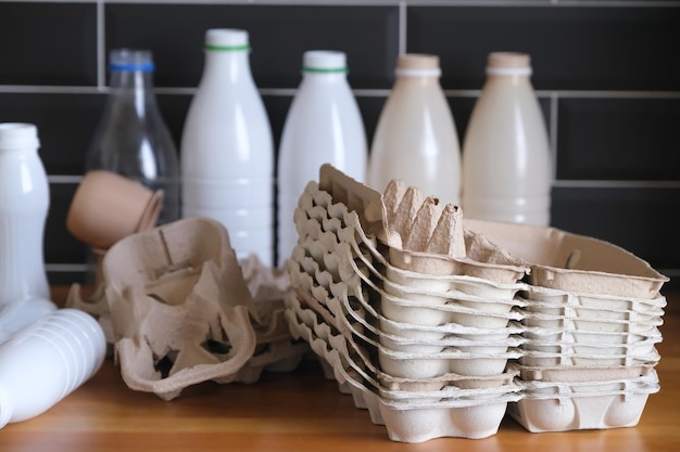 Egg boxes, plastic bottles are sorted for recycling, separate garbage at home