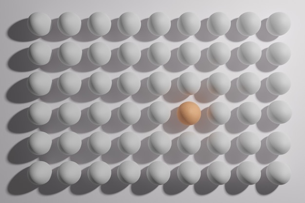 Marrone d'uovo tra una moltitudine di uova bianche. concetto di differenza.