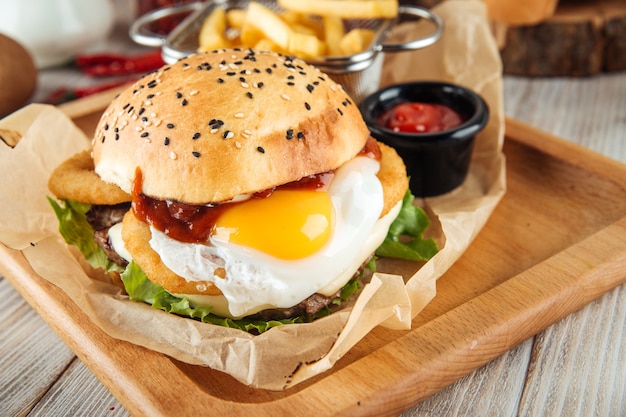 Egg burger combo set with fries and ketchup