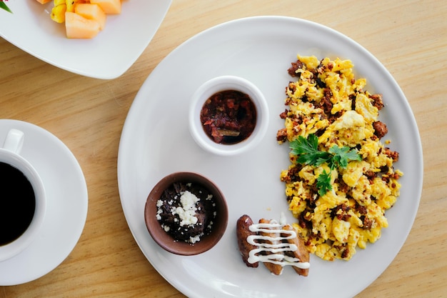 Egg dish with sausage at a restaurant table. Food.