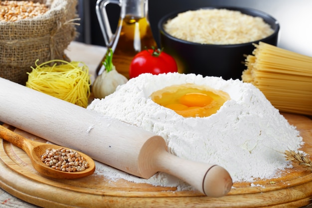 Egg in flour on a wooden board