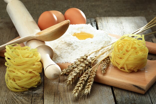 Egg in flour on a wooden board