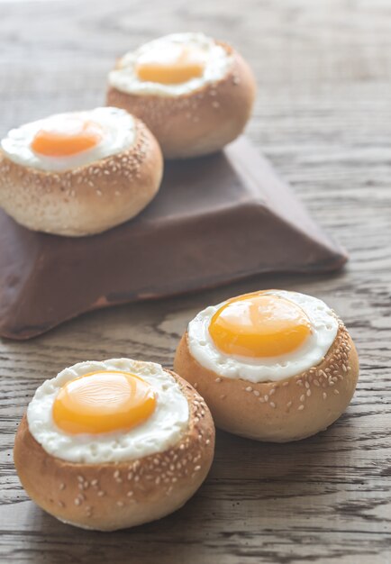 Egg-in-a-hole buns on the wooden board