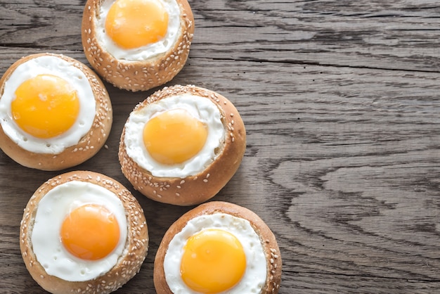 Egg-in-a-hole buns on the wooden board