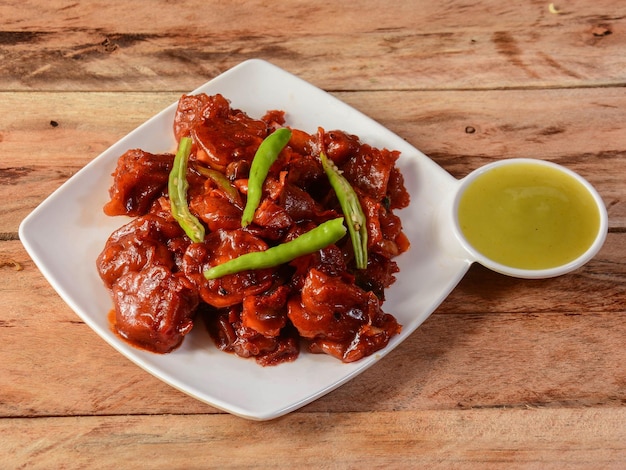 Egg manchurian served on rustic wooden background