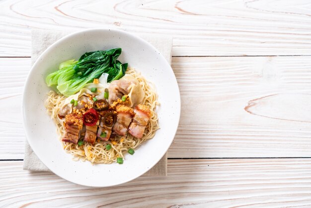 egg noodle soup with crispy pork belly and wonton