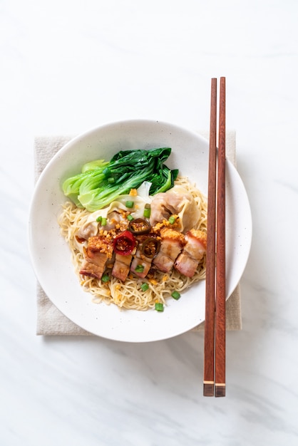 Egg noodle soup with crispy pork belly and wonton