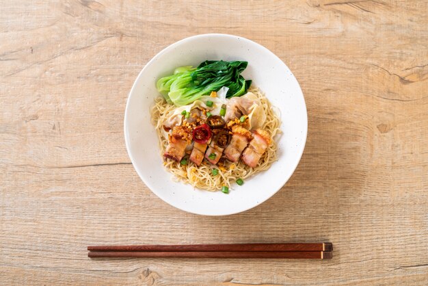 egg noodle soup with crispy pork belly and wonton