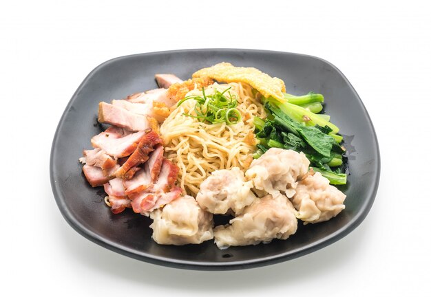 Egg noodle with red roast pork, crispy pork and dumplings