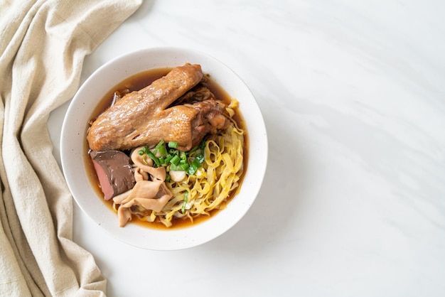 Egg noodles with stewed and braised duck in brown soup